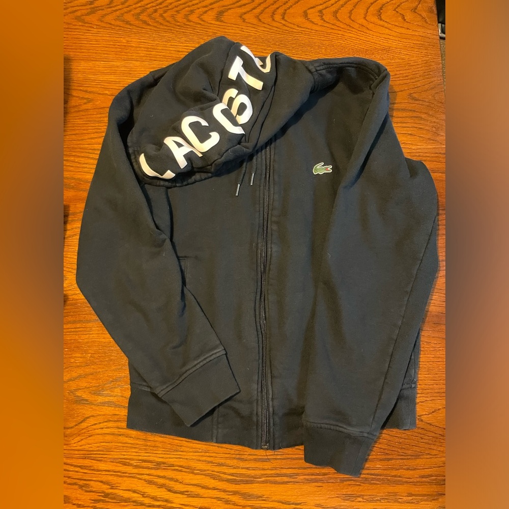 LACOSTE- men’s black hooded zip jacket with front pocket.